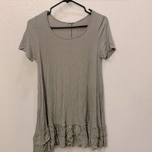 This is a women’s long shirt, green Los Angeles brand